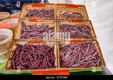 Buchettes ('sticks' of meats) for sale in street market - France. Stock Photo
