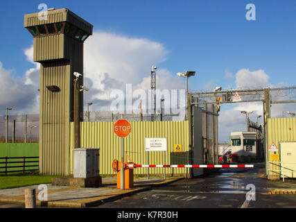 The high observation towers and security fencing at the entrance to the Magilligan Prison in County Londonderry on the North Coast of Ireland Stock Photo