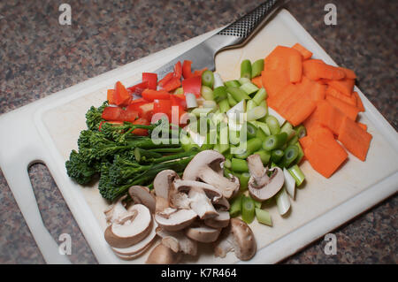 Chopped vegetables on a chopping board Stock Photo