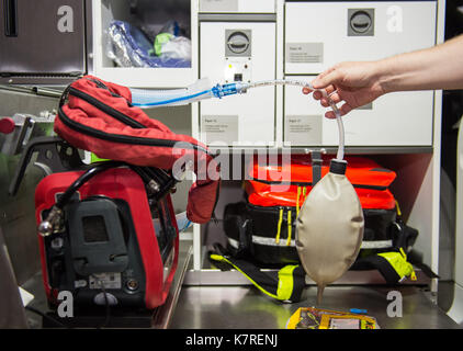 Hanover, Germany. 11th Aug, 2017. An emergency doctor checks a respirator in an ambulance at the Feuer- und Rettungswache 3 (lit. fire and ambulance station 3) in Hanover, Germany, 11 August 2017. Photo: Silas Stein/dpa/Alamy Live News Stock Photo