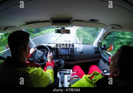 Hanover, Germany. 11th Aug, 2017. Paramedic Axel Kernbach (l) and a colleague driving to a call out in Hanover, Germany, 11 August 2017. Photo: Silas Stein/dpa/Alamy Live News Stock Photo