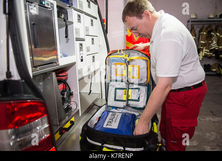 Hanover, Germany. 11th Aug, 2017. An emergency doctor checks an emergency backpack, which he always takes with him on a call out, at the Feuer- und Rettungswache 3 (lit. fire and ambulance station 3) in Hanover, Germany, 11 August 2017. Photo: Silas Stein/dpa/Alamy Live News Stock Photo