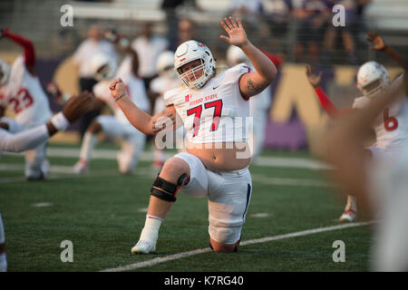 Seattle, WA, USA. 16th Sep, 2017. Fresno lineman Aaron Mitchell (77) stretches before a NCAA football game between the Fresno State Bulldogs and the Washington Huskies. The game was played at Husky Stadium in Seattle, WA. Jeff Halstead/CSM/Alamy Live News Stock Photo