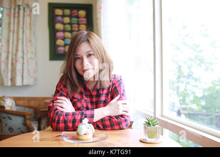 asian girl have meal, tea time in the cafe Stock Photo