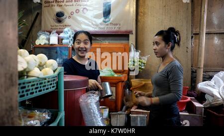 Two Sisters Working at Coffee Tea and Beverage Shop at Phsar Toul Tom Poung the Bazaar Russian Market in  Phnom Penh, Cambodia South East Asia Stock Photo