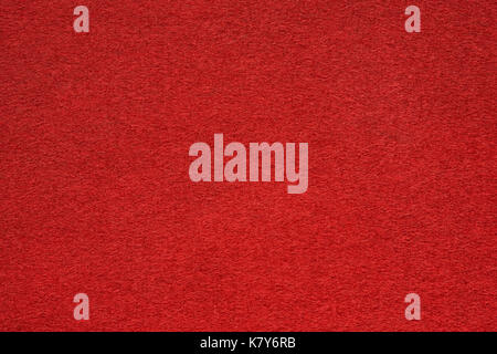 Red felt table surface extremal close up. Large macro texture and background Stock Photo