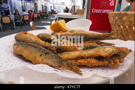 Deep fried small fish, boquerones fritos, battered and fried anchovies  typical in Spain Stock Photo