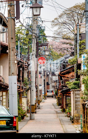 Higashi Chaya popular tourist district of Kanazawa, Japan. Typical very narrow Japanese street with houses on both sides and narrow pavements. Stock Photo