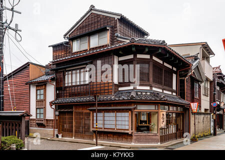 Japan, Kanazawa, Higashi Chaya tourist district. Traditional Edo period wooden Japanese restaurant, corner view. Dark wooden building, three storey. Stock Photo