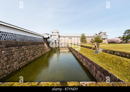 Kanazawa castle, Japan. View along Taiko-bei wall and moat, to Gojikken Nagaya, long storeroom with Hishi and Tsuzuki yagura, turrets, at each end. Stock Photo