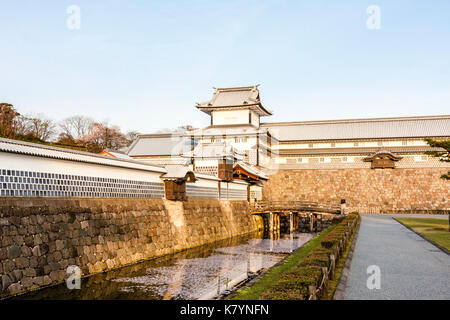 Kanazawa castle, Japan. Reconstructed Taiko-bei wall with Daishi windows, Hashizume icho-no-mon gate with Tsuzuki Yagura, turret, and inner moat. Stock Photo