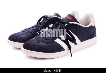 SAMARA, RUSSIA - June 20, 2017: Blue Adidas sneakers for running, football, training, in gray and blue, showing the red Adidas logo and famous three s Stock Photo