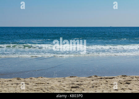 Beautiful waves roll and crash along the shore at Sea Girt beach in New Jersey. Stock Photo