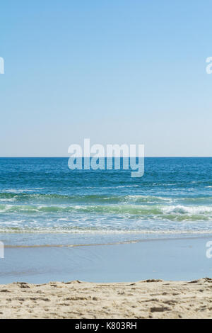 Beautiful waves roll and crash along the shore at Sea Girt beach in New Jersey. Stock Photo