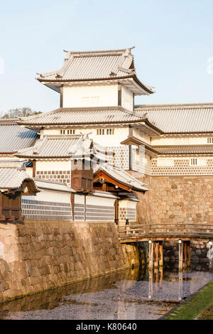 Kanazawa castle, Japan. Reconstructed Taiko-bei wall with Daishi windows, Hashizume icho-no-mon gate with Tsuzuki Yagura, turret, and inner moat. Stock Photo