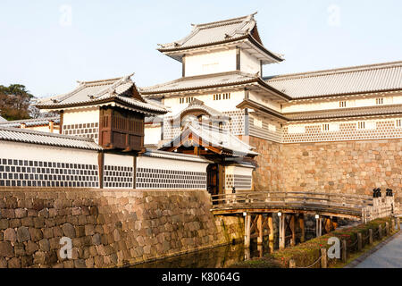 Kanazawa castle, Japan. Reconstructed Taiko-bei wall with Daishi windows, Hashizume icho-no-mon gate with Tsuzuki Yagura, turret, and inner moat. Stock Photo