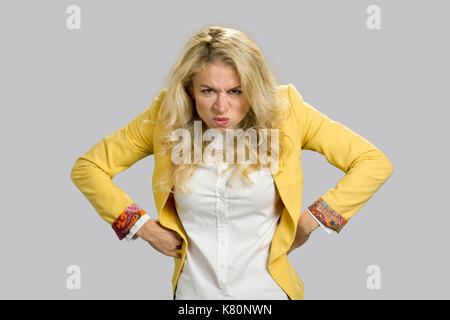 Aggressive frowning young business woman. Stock Photo