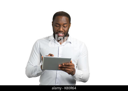 Black businessman using computer tablet. Stock Photo