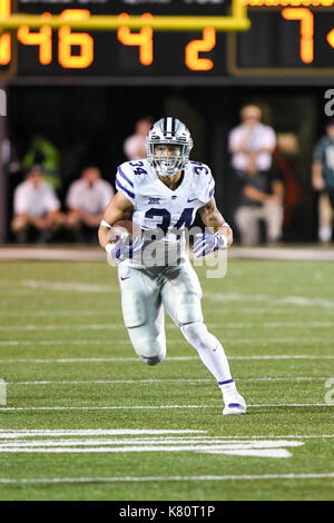 Commandres Running Back Kansas State Wildcats running back Rodney Fields Jr. (20) is stopped ...