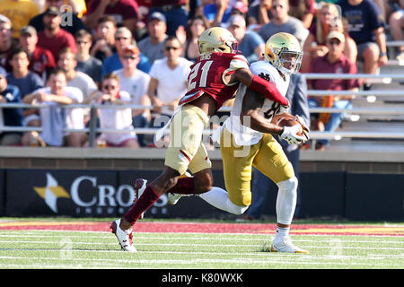 Alumni Stadium. 16th Sep, 2017. MA, USA; Boston College Eagles defensive back Lukas Denis (21) tackles Notre Dame Fighting Irish tight end Alize Mack (86) during the first half of the NCAA football game between Notre Dame Fighting Irish and Boston College Eagles at Alumni Stadium. Notre Dame defeated Boston College 49-20. Anthony Nesmith/CSM/Alamy Live News Stock Photo