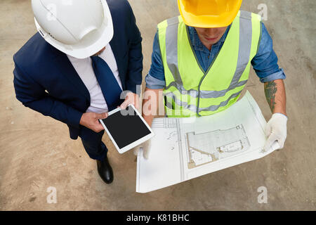 Working Meeting of Foreman and Architect Stock Photo