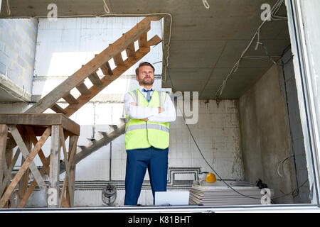 Bearded Businessman at Construction Site Stock Photo