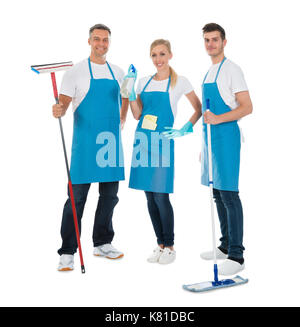 Group Of Cleaning Workers With Cleaning Equipments Over White Background Stock Photo