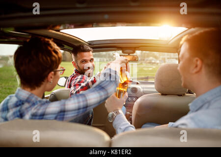 Friends enjoying time together on road trip in the beer Stock Photo