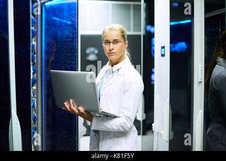 Female Scientist Posing with Supercomputer Stock Photo