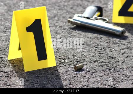 ID tents at crime scene after gunfight Stock Photo