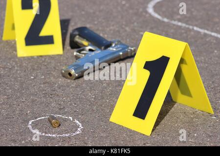 ID tents at crime scene after gunfight Stock Photo