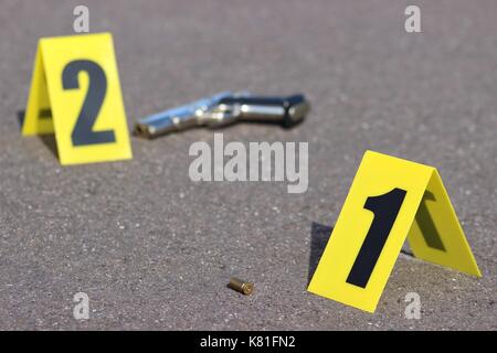 ID tents at crime scene after gunfight Stock Photo