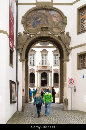 Couple entering the Füssen Heritage Museum, Bavaria, Germany, Europe Stock Photo