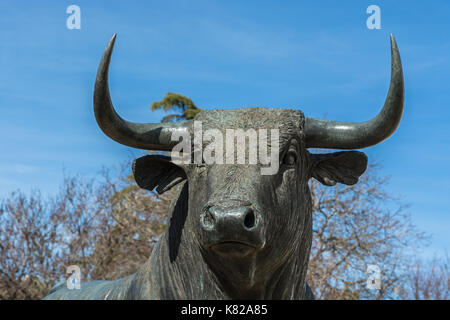 Ronda, Spain - March 7, 2017: Bull statue in front of the bullfighting arena in Ronda, Andalusia, Spain. Stock Photo