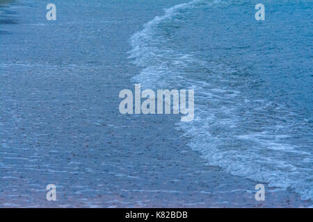 large raindrops falling on the sea during a strong thunderstorm on the Mediterranean Sea, in Liguria Stock Photo