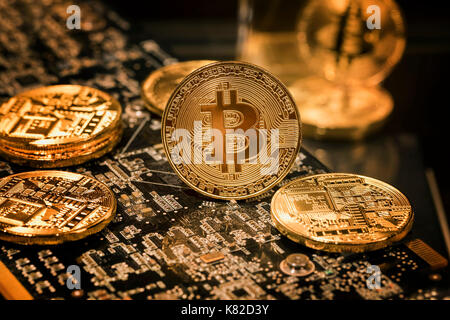 View of a stack of bitcoins on background of electronick schemes - blockchain and cyber currency concept Stock Photo