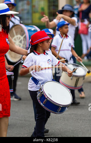 Tilaran, Costa Rica - September 15 : School children marching in the town square playing percussion instruments for the independence day parade. Septe Stock Photo