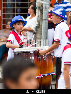 Tilaran, Costa Rica - September 15 : School children marching in the town square playing percussion instruments for the independence day parade. Septe Stock Photo