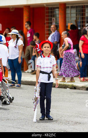 Tilaran, Costa Rica - September 15 : School children marching in the town square playing percussion instruments for the independence day parade. Septe Stock Photo