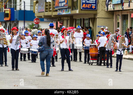 Tilaran, Costa Rica - September 15 : School children marching in the town square playing percussion instruments for the independence day parade. Septe Stock Photo