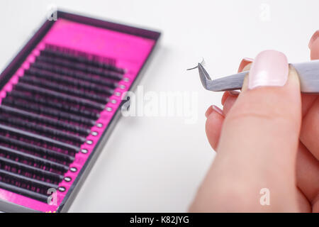 Eyelash Extension tools on white background. Accessories for eyelash extensions. Artificial lashes. Stock Photo
