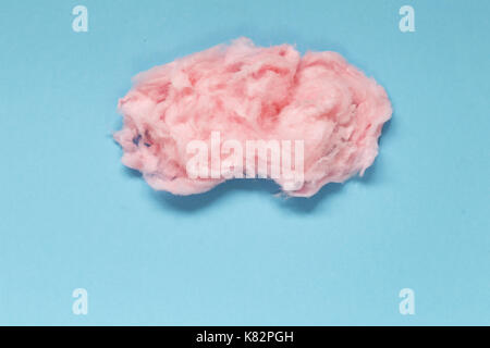 Sweet pink cotton candy on a colored background Stock Photo