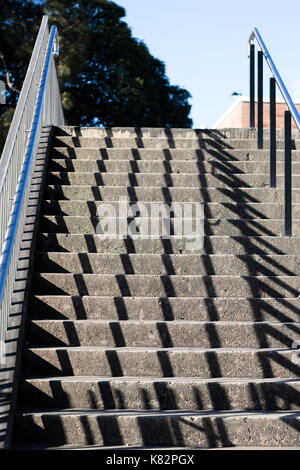 Shaow of railings on stairs Stock Photo