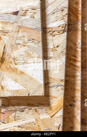The OSB panels are stacked close-up. Stock Photo