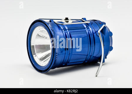 blue multifunction rechargeable flashlight isolated with white background Stock Photo