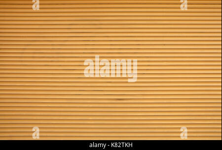 Beige brown painted horizontal metal window roller shutter blinds or garage doors background texture Stock Photo