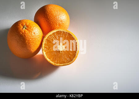 Delicious fresh oranges isolated on white background. Stock Photo