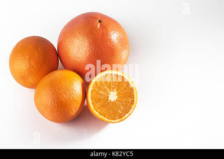 Delicious fresh oranges isolated on white background. Stock Photo