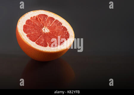 Grapefruit isolated on a black background Stock Photo