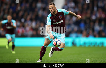 Marko Arnautovic of West Ham United and Christopher Schindler of